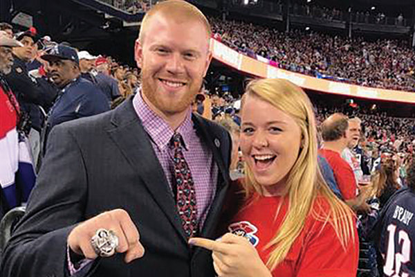 Alex Marshall ’14 shows off his Super Bowl ring at a recent Patriots game with his sister Nicole Marshall ’17
