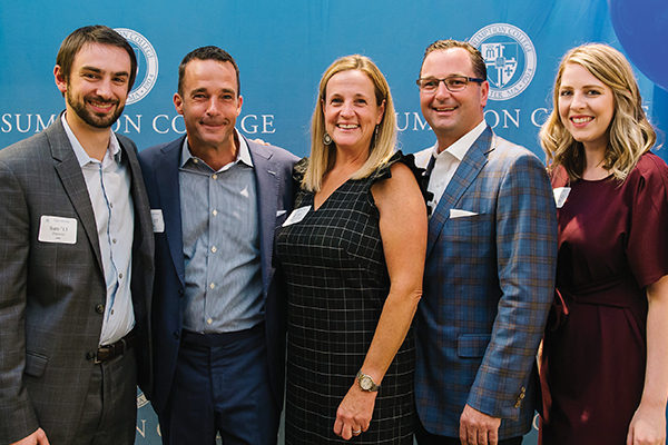 Sam Pericolo ’13, Sean Clarke ’97, Jill (Clarke) Fotiades ’93, Michael Fotiades ’92, and Kelsey (Keough) Hodde ’12 during a September alumni reception. The event, which drew 175 guests including many alumni, was hosted by the Clarke and Fotiades families at their showroom in Boston’s Seaport District. Pericolo and Hodde began at Clarke as interns before becoming full-time employees after graduating from Assumption.