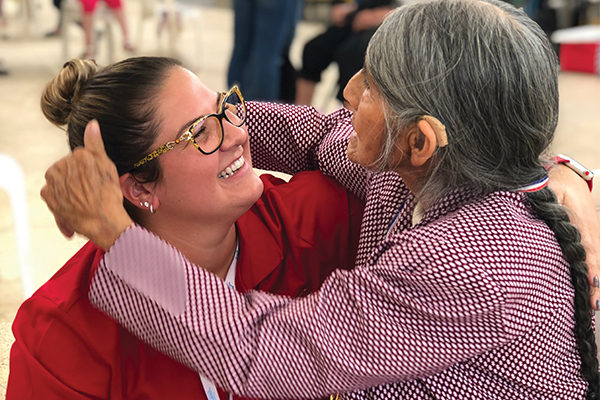 A Peruvian woman embraces Meaghan Curley ʼ16  after she fit her with a hearing aid, allowing her to  hear for the first time.
