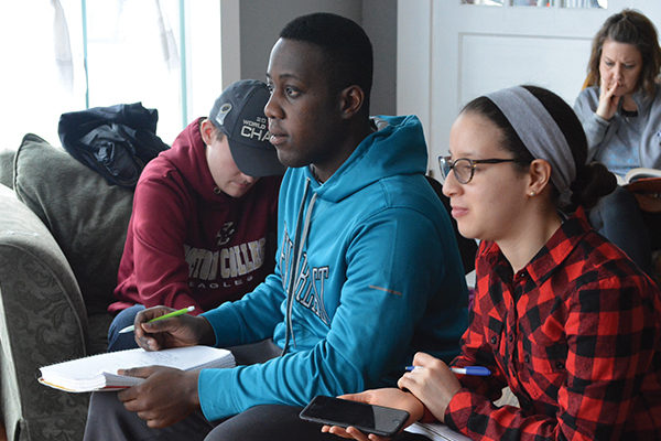 Students in Professor James Lang’s English Composition course listen to the stories of residents living at the Interfaith Hospitality  Network during a  
class visit in February.