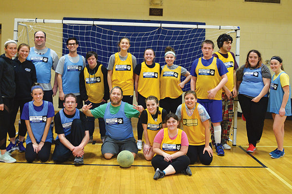 Assumption students and Special Olympics athletes celebrate the end of the inaugural Unified Sports soccer league last fall.