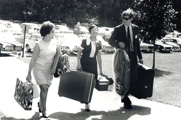 A male upperclassman assists a newly arrived female first-year student on September 12, 1969. A closer look reveals that they were headed for Alumni Hall, where the women would be housed on one of the floors while waiting for the Hill Dorms (Nault, Young, and Harrington) to be completed (construction had begun that spring).