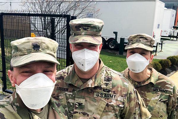 John Giordano, DMD '92  (left) was called to active duty for the Massachusetts Army National Guard in March to help in the fight against COVID-19.
