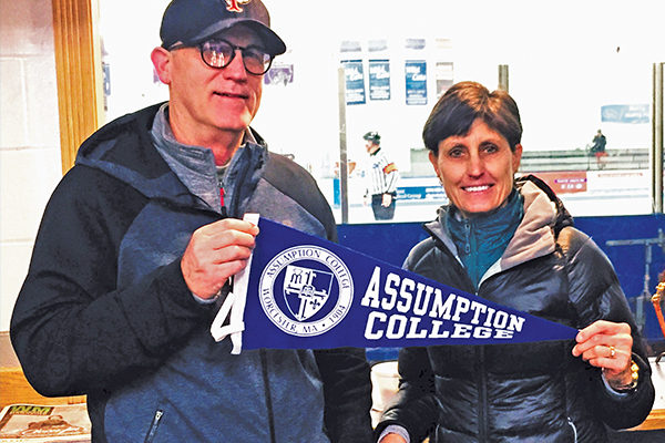 Dr. Ted Barton and wife Cindy  Litzenberger watching their son Ben Barton ’20 play  hockey at Assumption.