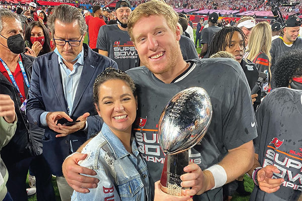 Zach Triner ’15 and his wife, Carissa, hold the coveted Lombardi Trophy after the Tampa Bay Buccaneers won Super Bowl LV in February.