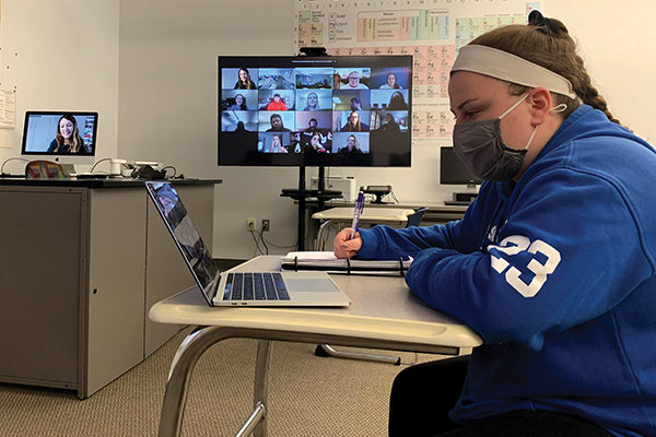 Allison Collins ’22 takes notes during one of the hybrid class meetings.